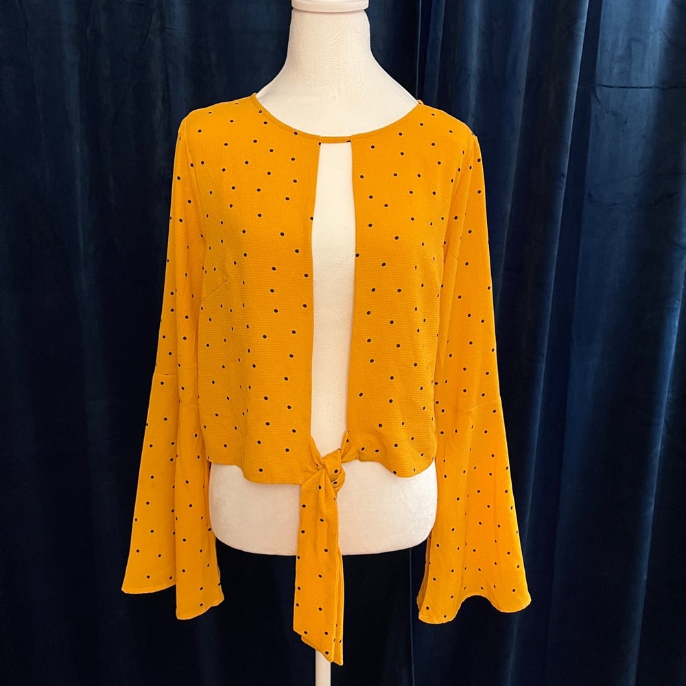 Yellow, black polka dotted long sleeve bell sleeve top